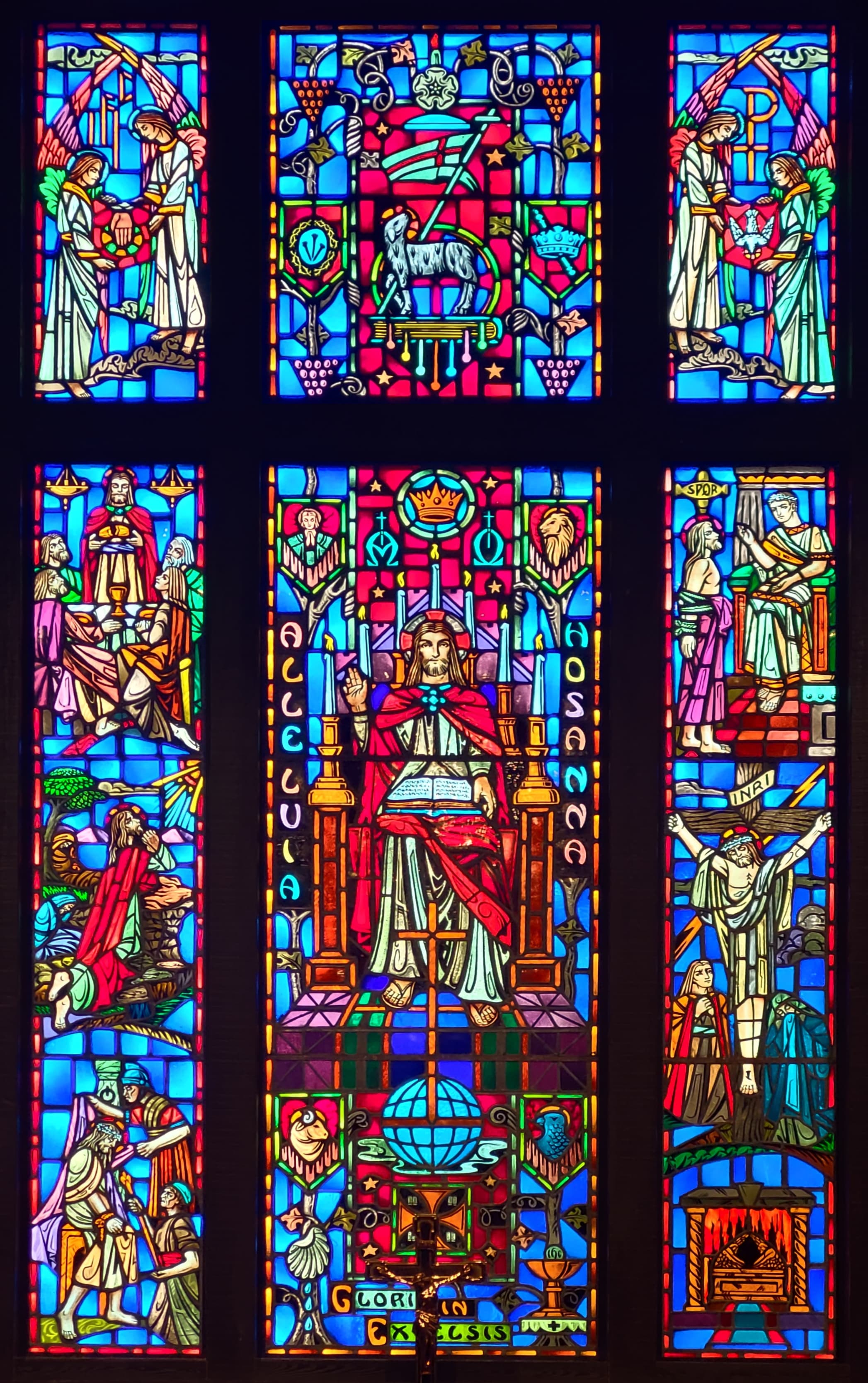The stained-glass window at the front of the church