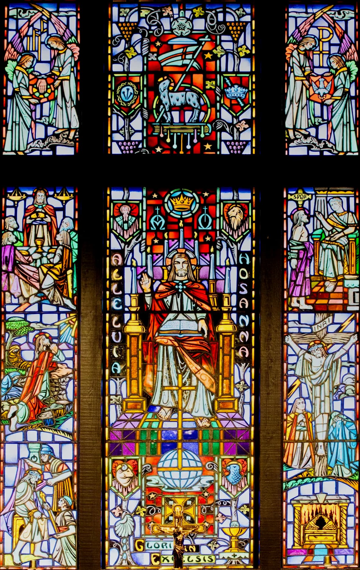 The stained-glass window at the front of the church